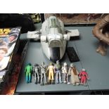 An unboxed Slave 1 Star Wars vehicle with a collection of Bounty Hunters