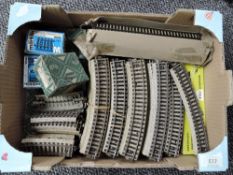 A box containing 80 pieces of Marklin HO Track, large and small curves approx 10 metres