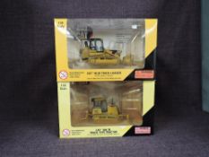 Two Norscot 1:50 scale diecasts, CAT D6K XL Track Type Tractor in yellow, in plastic packaging and