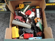 A box of mixed vintage playworn diecasts including early Dinky Vanguard, Triumph and Austin Taxi,