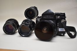 An Asahi Pentax 67 camera with Takamur 67 150mm lens, 105mm lens, Fish Eye 6x7 lens, a Pentax 6x7