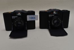 Two Minox 35GT cameras one with original case