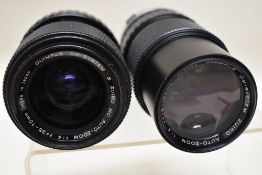 Seven Olympus OM System Zuiko lenses. A 75-150mm, a 35-70mm, a 28-48mm, three 50mm and a 28mm