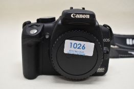 A Canon EOS 350D camera body with manual