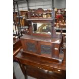 A Victorian mahogany hall or toilet mirror having Lincustra style panelled doors , self supporting