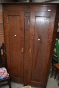 An Arts and Crafts mahogany full height corner hall robe, in the manner of Arthur Simpson or similar