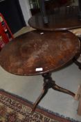 A 19th Century stained frame pedestal table having circular top on turned column with triple splay