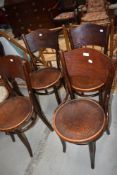 Four traditional bentwood chairs