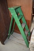 A set of traditional wooden step ladders