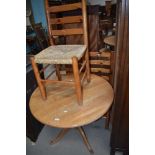 A Pine table and three chairs.