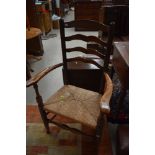 A late 18th/early 19th century rush seated ladder back chair, two rungs removed from lower portion.