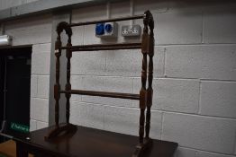 A traditional stained frame towel rail