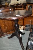 A stained frame occasional pedestal table