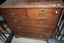 A 19th Century oak chest of two over three drawers having brass drop handles and bracket feet,