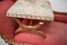 A 19th Century walnut cross frame dressing stool