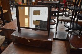 An Edwardian adjustable dressing table mirror having three draws and inlaid edging.