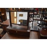 An Edwardian adjustable dressing table mirror having three draws and inlaid edging.