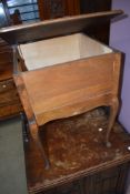 A vintage stained ply sewing table