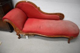 A Victorian stained frame chaise longue