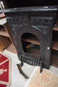 A cast iron fire surround etc