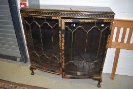 An early 20th Century Japanesque display cabinet in black laquer and gilt detailed