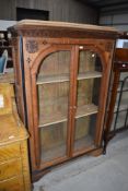 A Victorian Gothic style oak bookcase having inlaid decoration width 106cm height 158cm