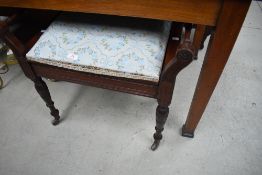 A late Victorian mahogany piano stool