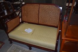 A good quality reproduction Victorian style cane backed sofa.