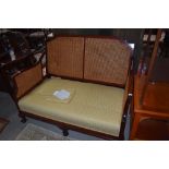 A good quality reproduction Victorian style cane backed sofa.