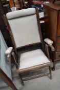 A 19TH Century stained frame folding chair with leatherette upholstery