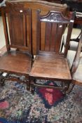Two period oak solid seat hall chairs