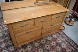 A modern golden oak sideboard/chest of drawers, width approx. 138cm, depth 43cm