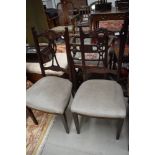 A pair of early 20th Century dining chairs having later dralon upholstery