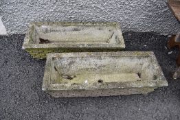 Two small concrete planters