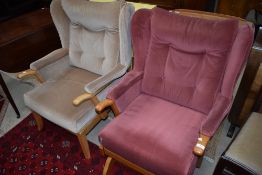 Two vintage oak framed chairs having dralon upholstery, being standard wing back and rocker