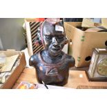 A 20th century ethnic hard wood hand carved bust of an African warrior