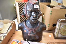 A 20th century ethnic hard wood hand carved bust of an African warrior