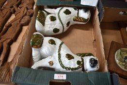 A pair of early 20th century Staffordshire flat back dogs in a Spaniel design