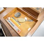 A polished metal dressing table set along with Dominoes and letter rack