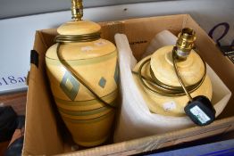 A pair of modern table lamps having decorated ceramic bodies