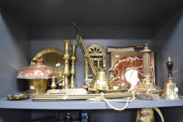 A good selection of brass and copper hardware including candle sticks lamp base and hand bell