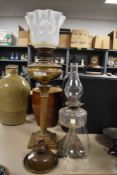 A Victorian oil lamp having Greek style column base with Vaseline glass light shade