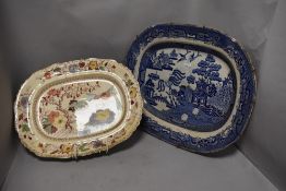Two antique ceramic charger plates including Masons and a traditional willow ware platter