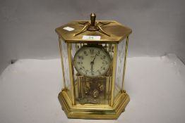 A Mid century Kienger and Oberghell anniversary clock, having floral enamel face, five glass