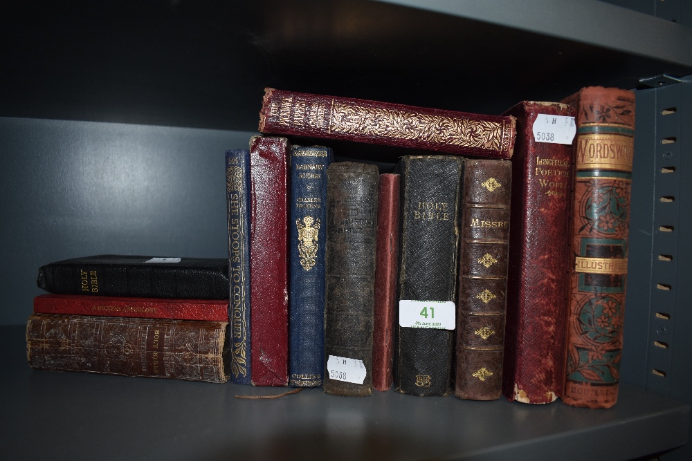 A miscellany of antique books including Dickens, Longfellows poetry, Wordsworth amongst others.