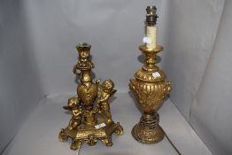 Two cast modern side lamps one as an urn and similar gilt cherub design