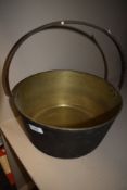 A brass and cast vintage jam pan