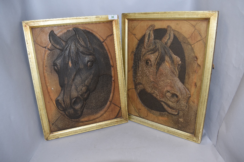 A pair of equine interest horse plaques having raised imagery