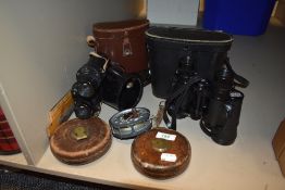 Two pairs of binoculars including Novolite 8x40 and Ross Stepvue 8x30 with measures and reel