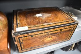 An antique jewellery case having ornate veneer case, with costume jewellery contents